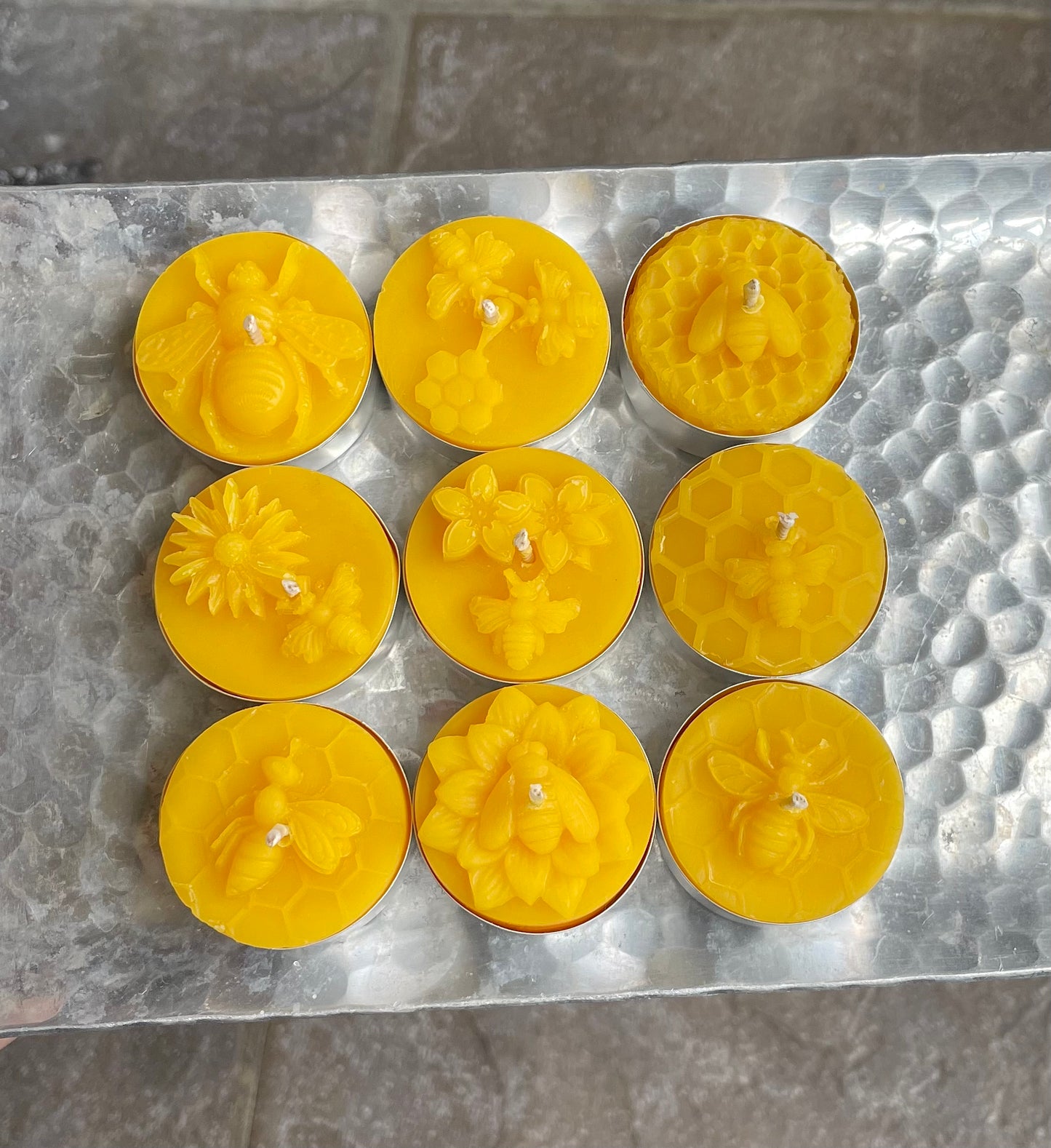 A collection of 9 honeybee tealight candles