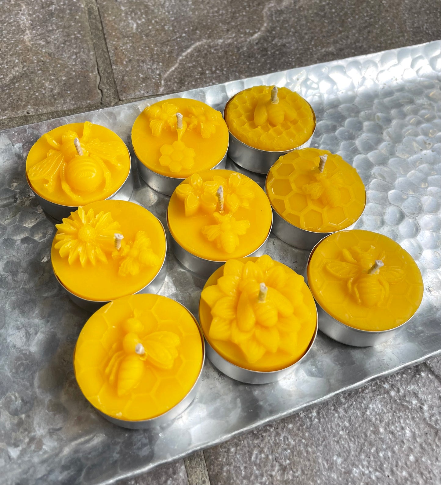 A collection of 9 honeybee tealight candles