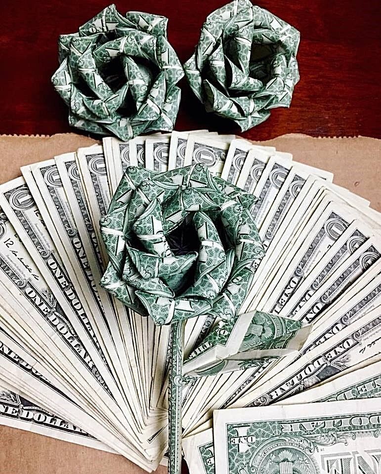 origami money rose made with 10 $1 bills