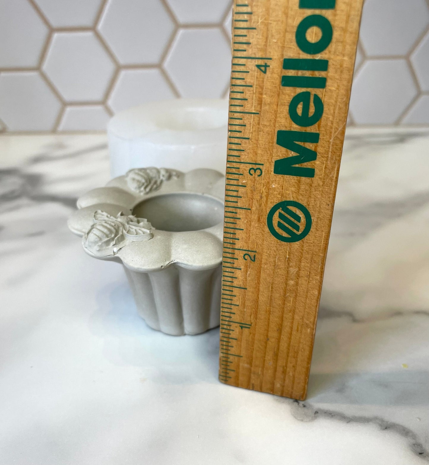 Concrete taper holder designed with honeybees