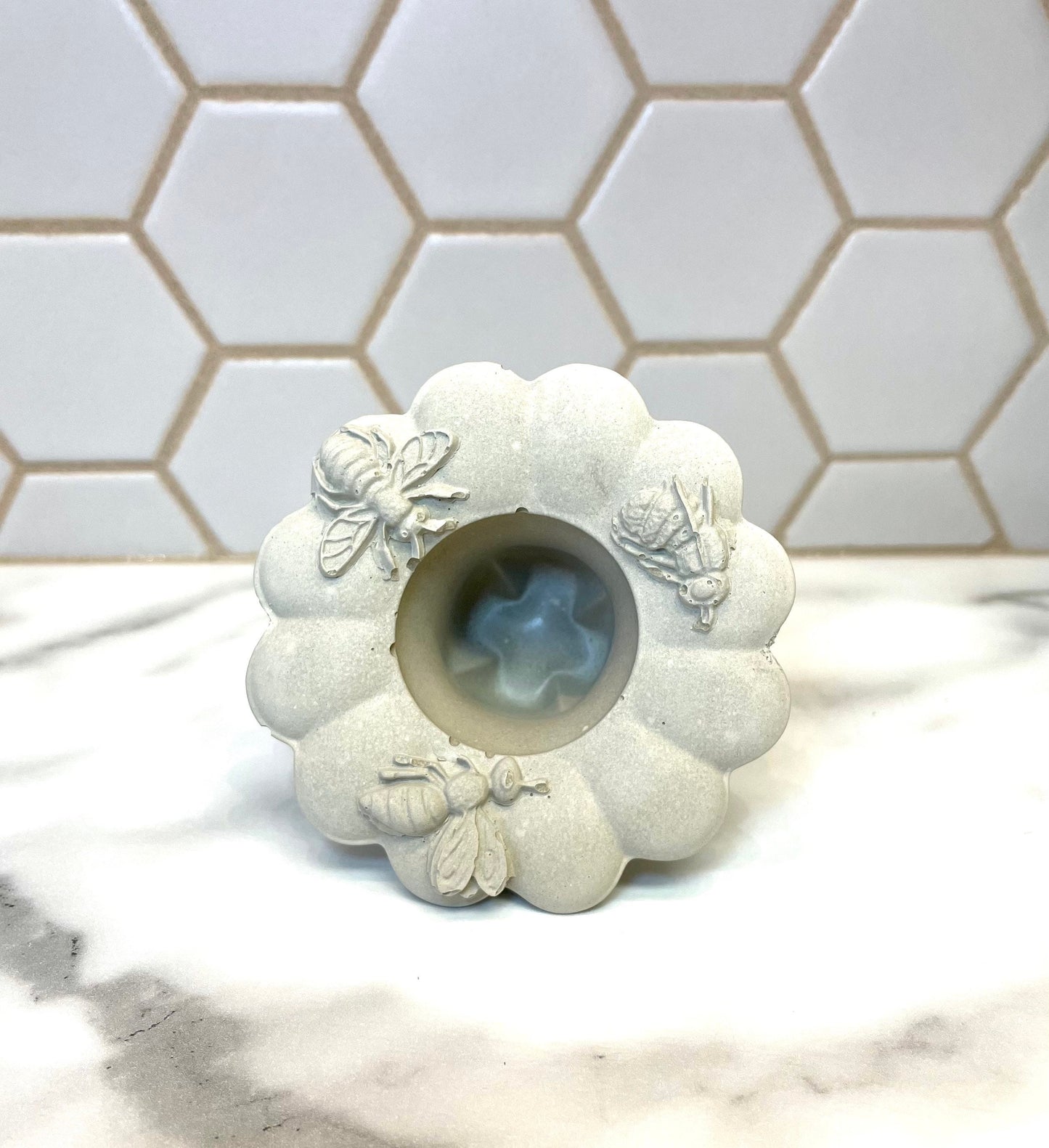 Concrete taper holder designed with honeybees