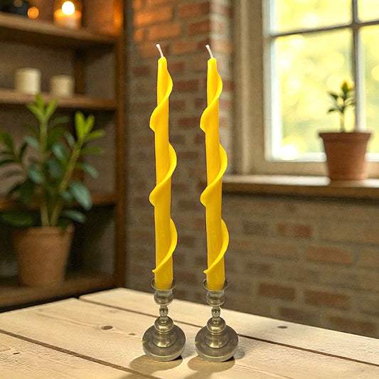 A set of two hand rolled pure beeswax spiral taper candles